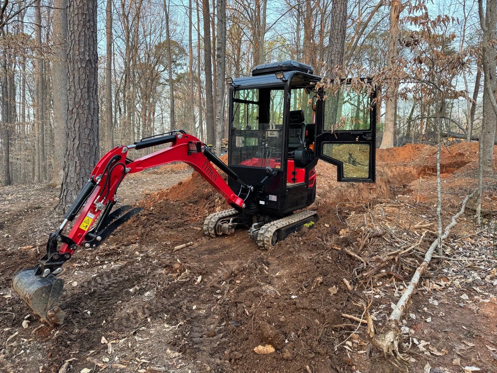 Excavator preparing ground for a gravel driveway